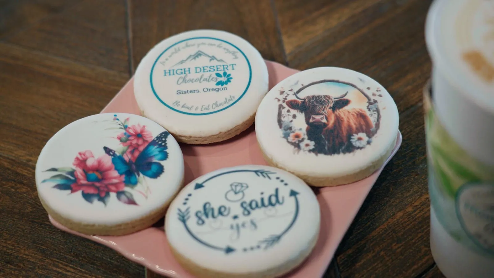 Custom hand-decorated logo sugar cookies for a celebration